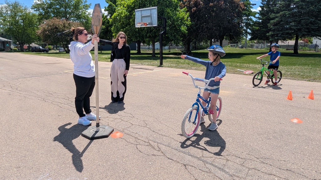 Second graders learning hand signals at the Bike Rodeo