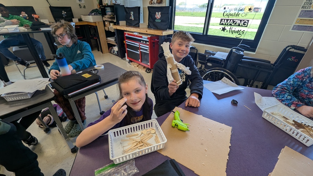 Peer STEM students making their own trolls