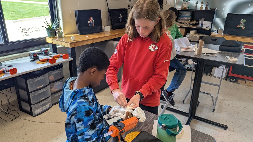Peer STEM students making their own trolls