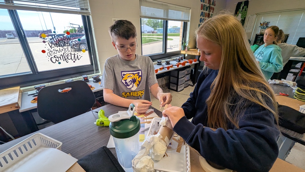 Peer STEM students making their own trolls
