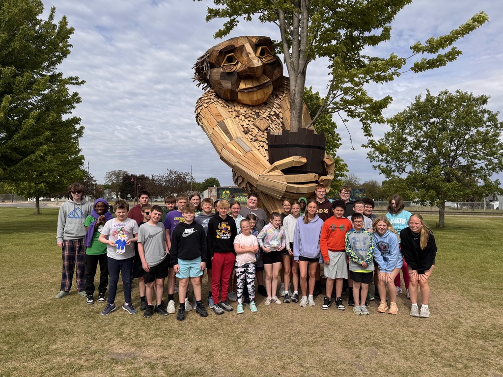 Peer STEM class visiting one of the Troll sculptures in Clinton, IA