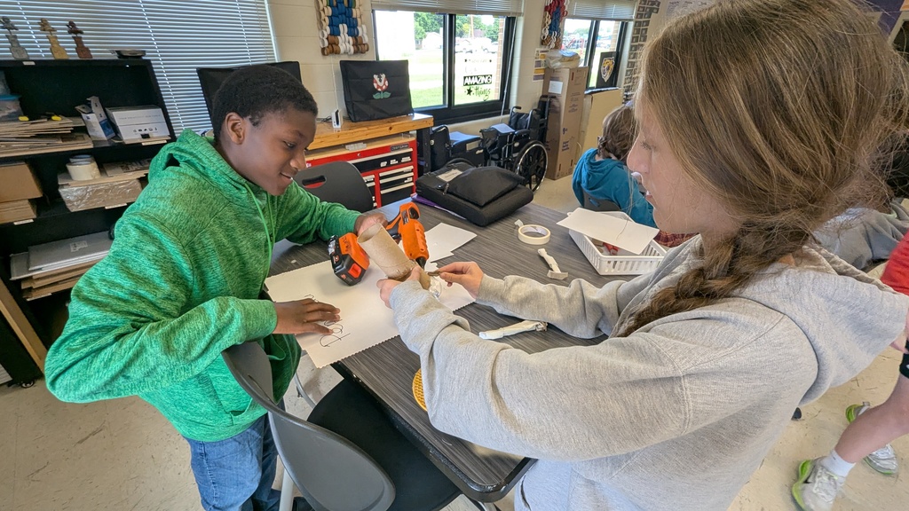 Peer STEM students making their own trolls