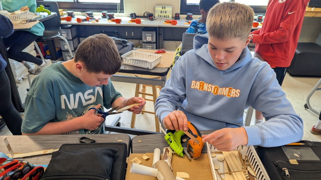 Peer STEM students making their own trolls
