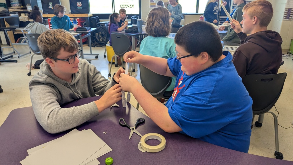Peer STEM students making their own trolls
