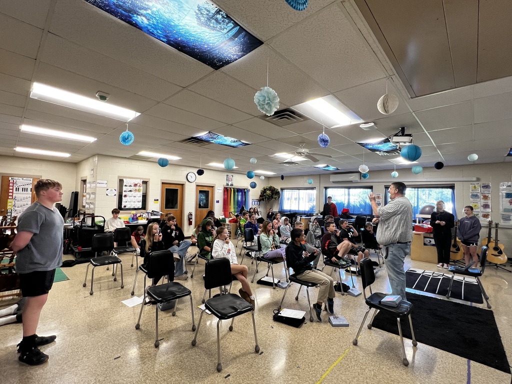 4th grader trying out musical instruments