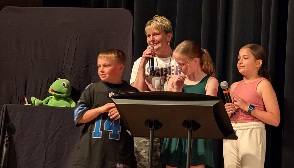 Mrs. Hahn and the 5th grade hosts of the talent show