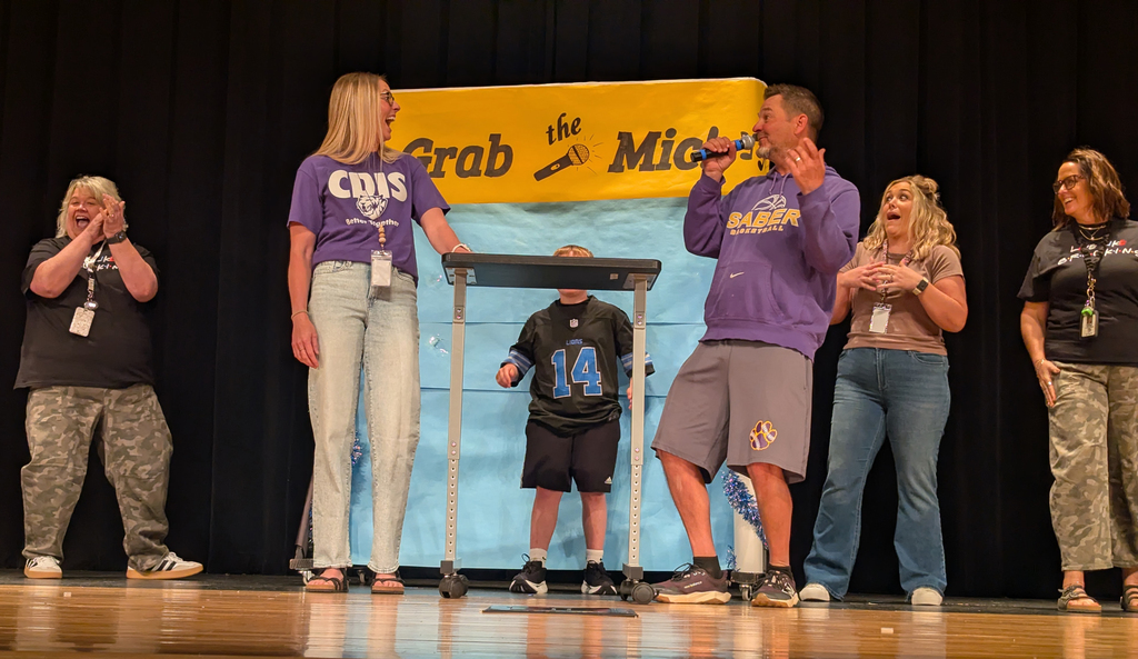 Staff competing in the Grab the Mic competition