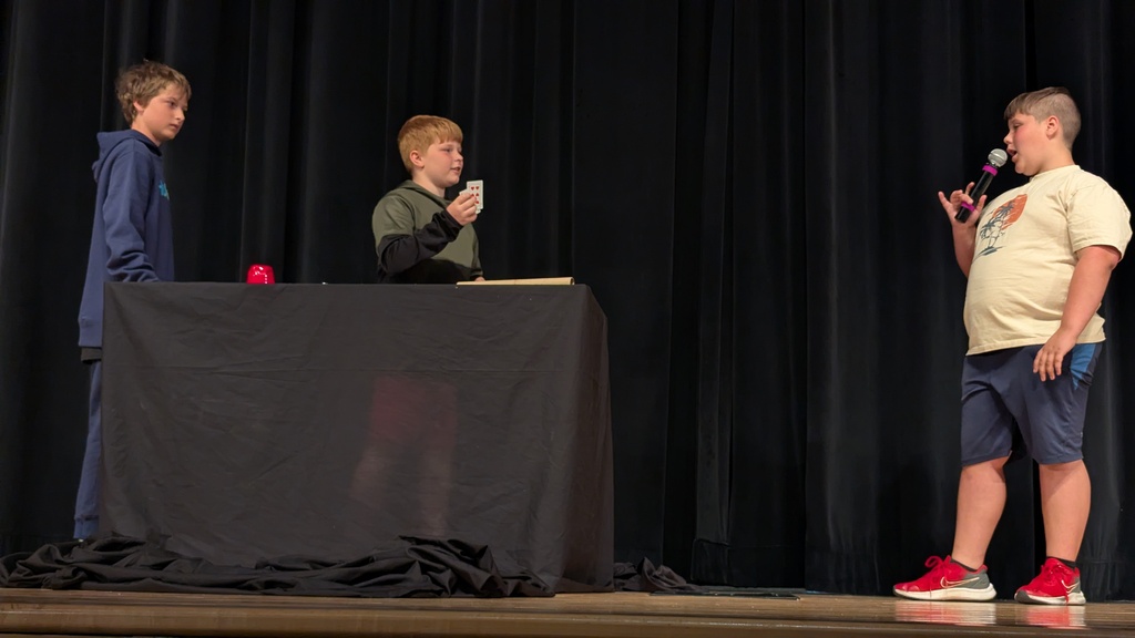 Students performing magic tricks
