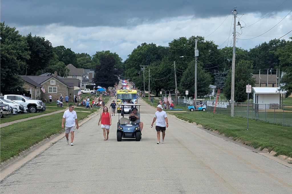 Central DeWitt students, administrators, school board members and Slash participating in the 4th of July parade