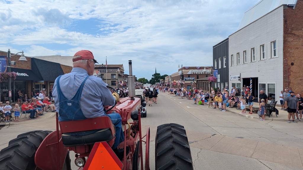 Central DeWitt students, administrators, school board members and Slash participating in the 4th of July parade