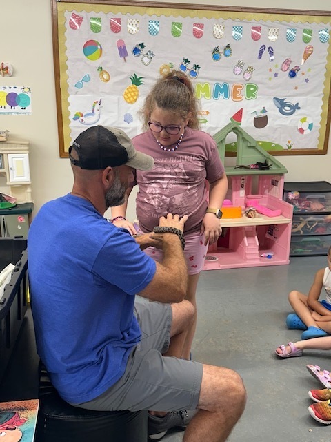 Clinton County Conservation showing students a snake