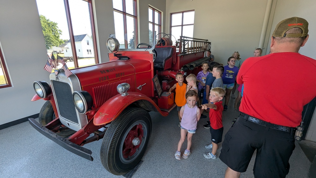 Students admiring the antique original DeWItt fire truck