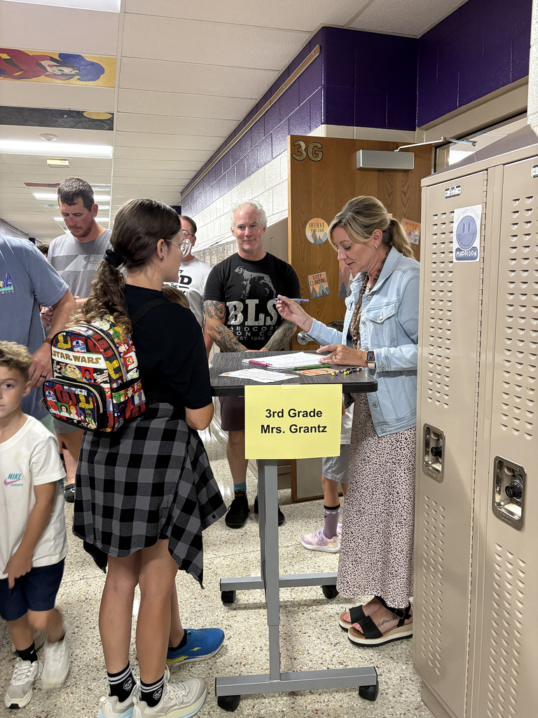 Mrs. Grantz welcoming a student