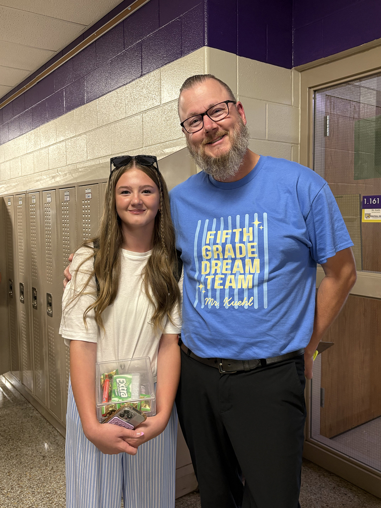 Mr. Kuehl posing with a student