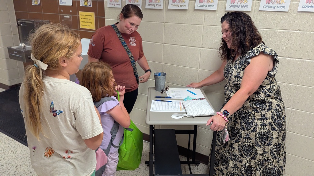 Mrs. Osmun welcoming a new 1st grader