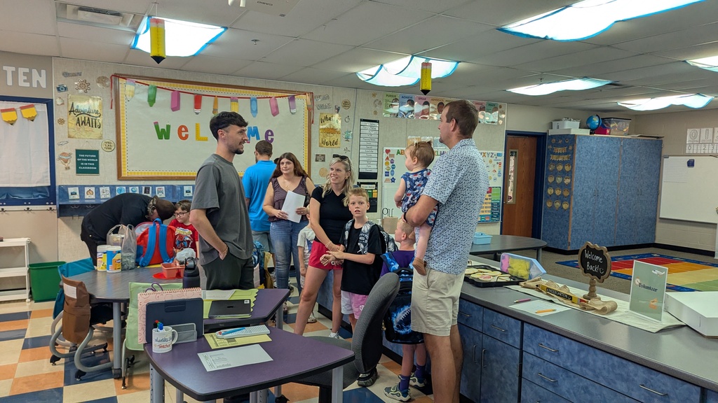 Mr. Thomas introducing himself to a family