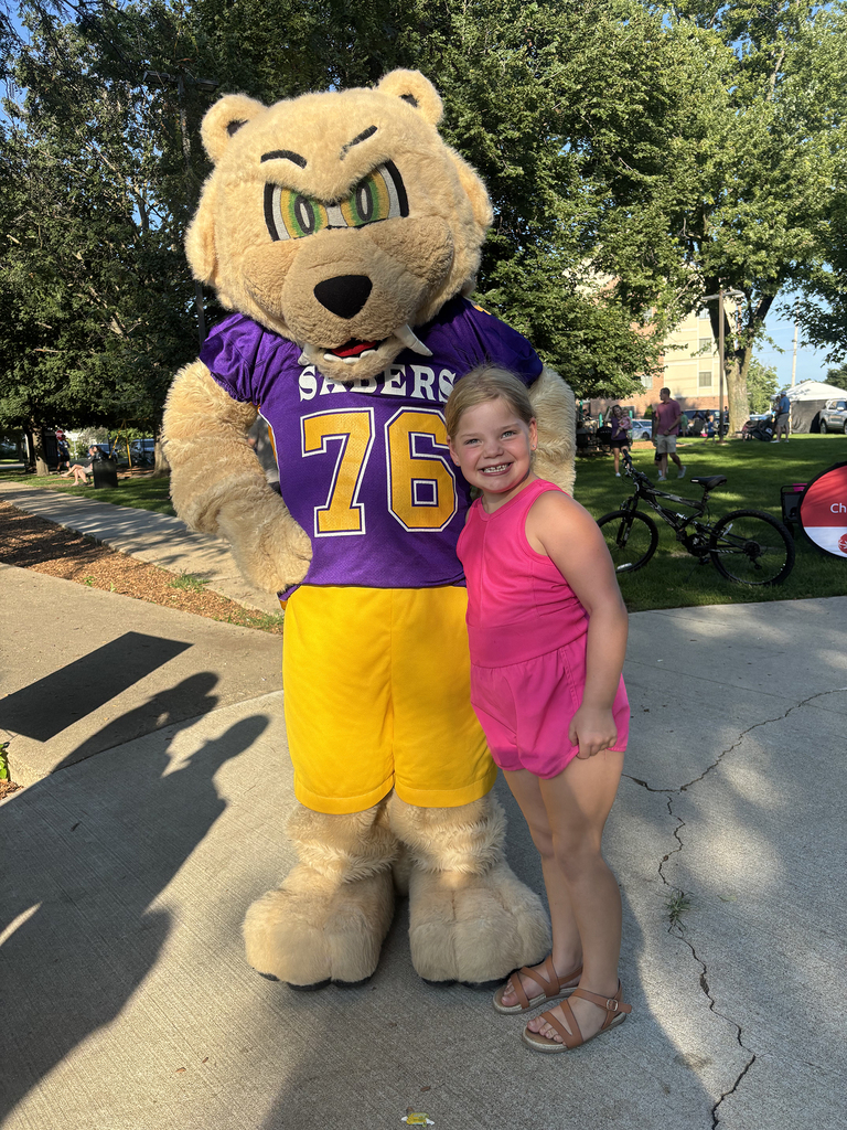 Slash and a Central DeWitt student at the DeWitt Farmer's Market