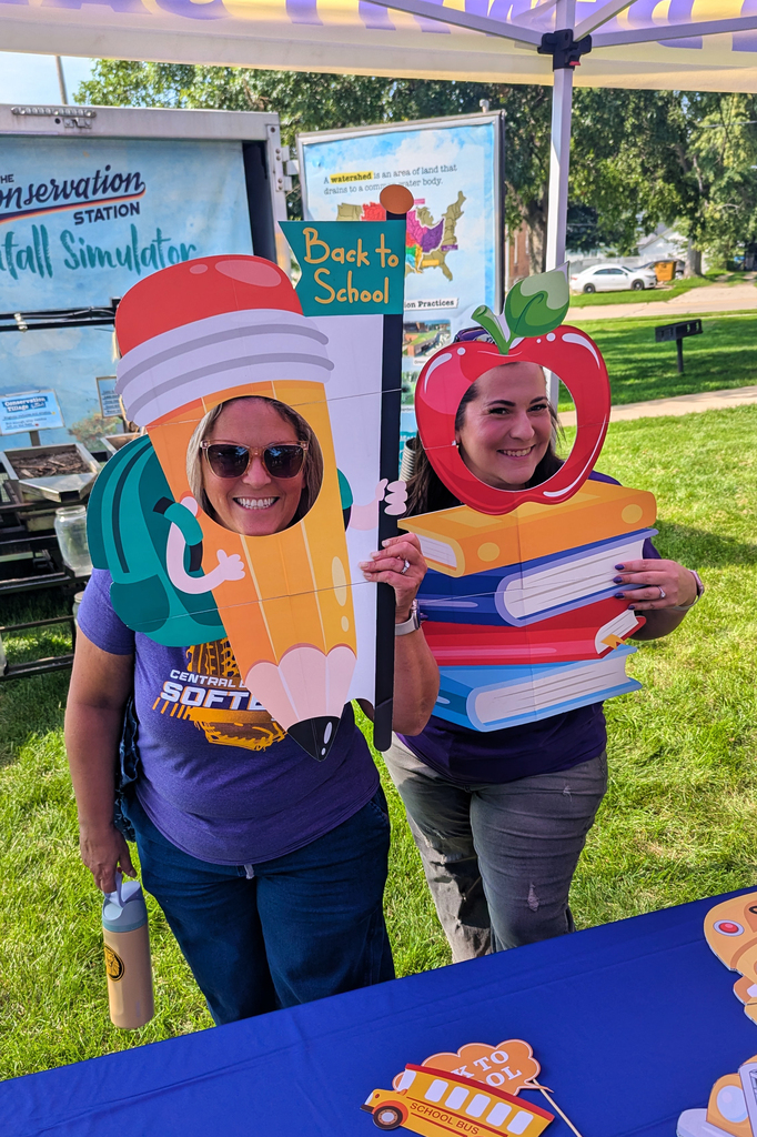 Mrs. Soenksen and Ms. Tibbietts at with back-to-school photo props