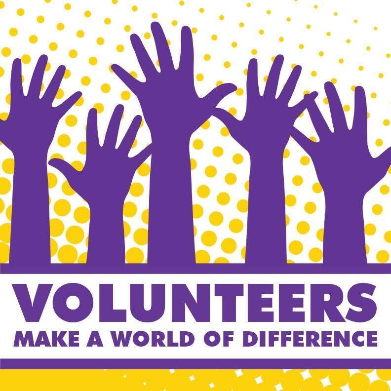 Hands raised to become a volunteer