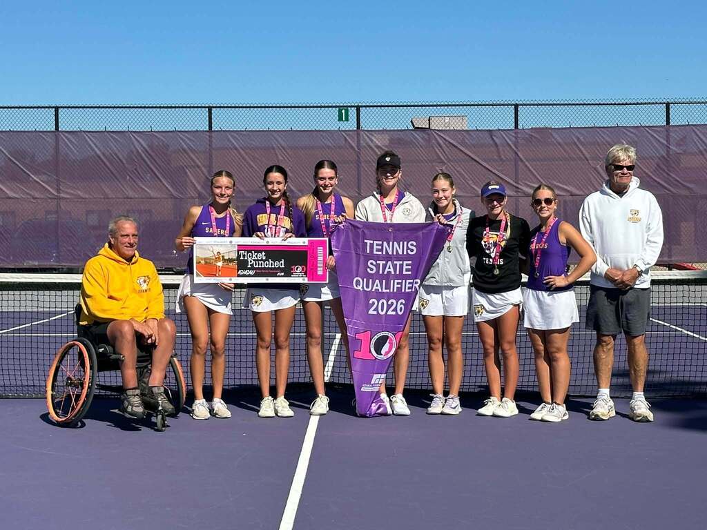 Girls Tennis team and coaches holding state banner and ticket