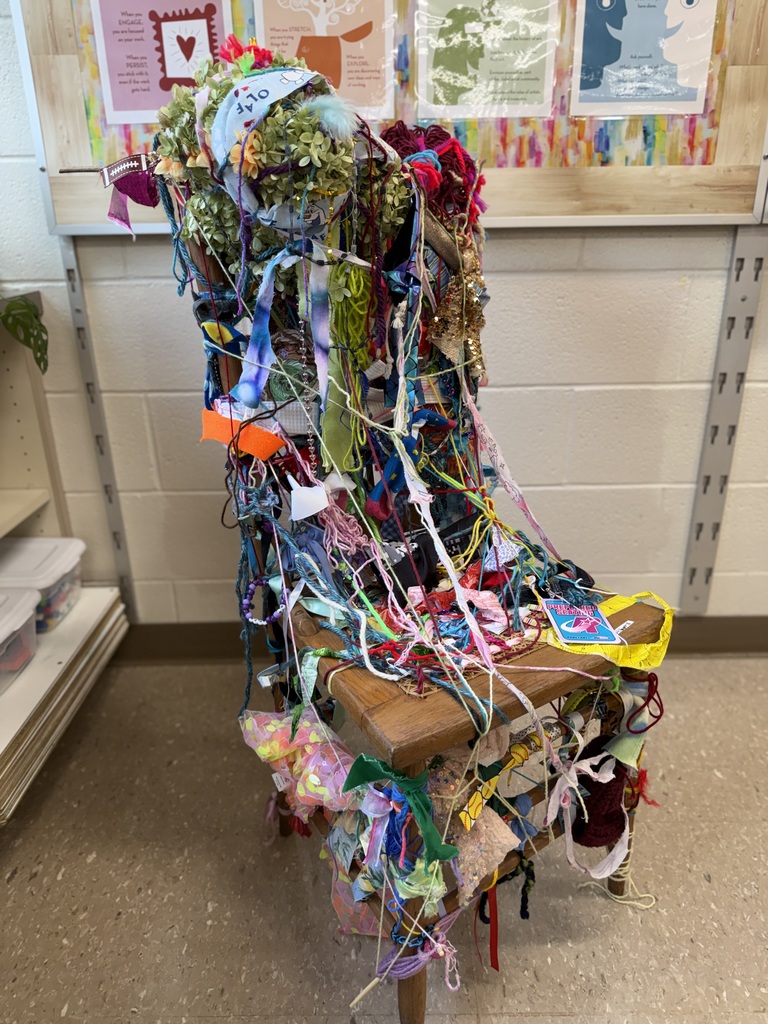 The finished collaborative chair covered in the items students and staff attached