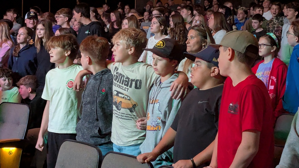 Middle school students singing Country Roads together