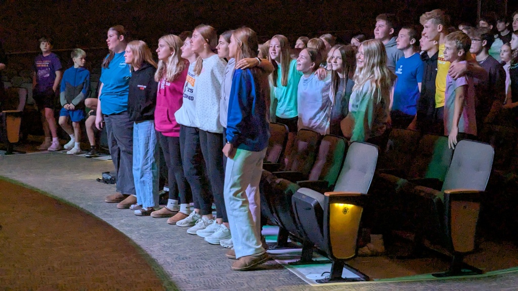 Middle school students singing Country Roads together