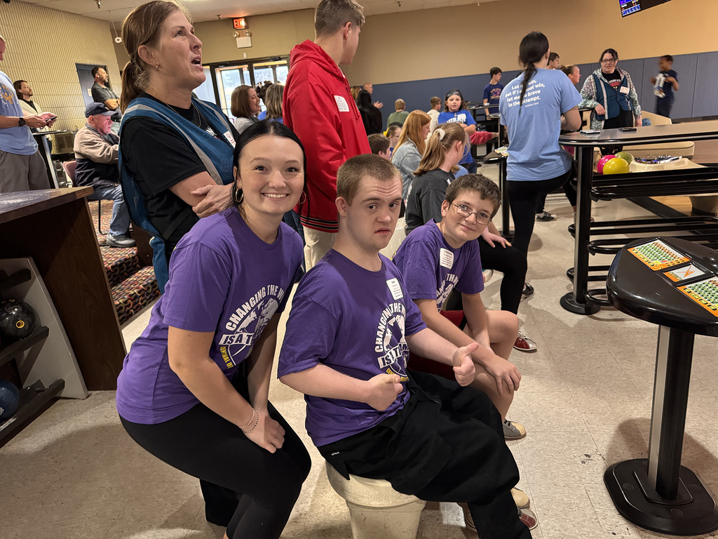 Unified Special Olympic athletes and partners at bowling tournament