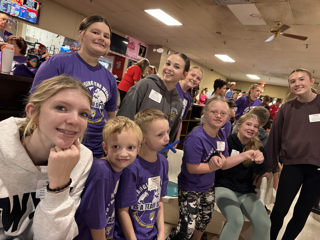 Unified Special Olympic athletes and partners at bowling tournament