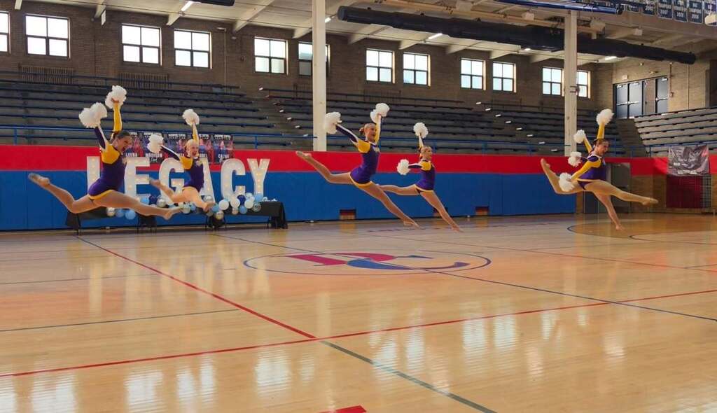 Central DeWitt cheer team performing at Legacy Competition