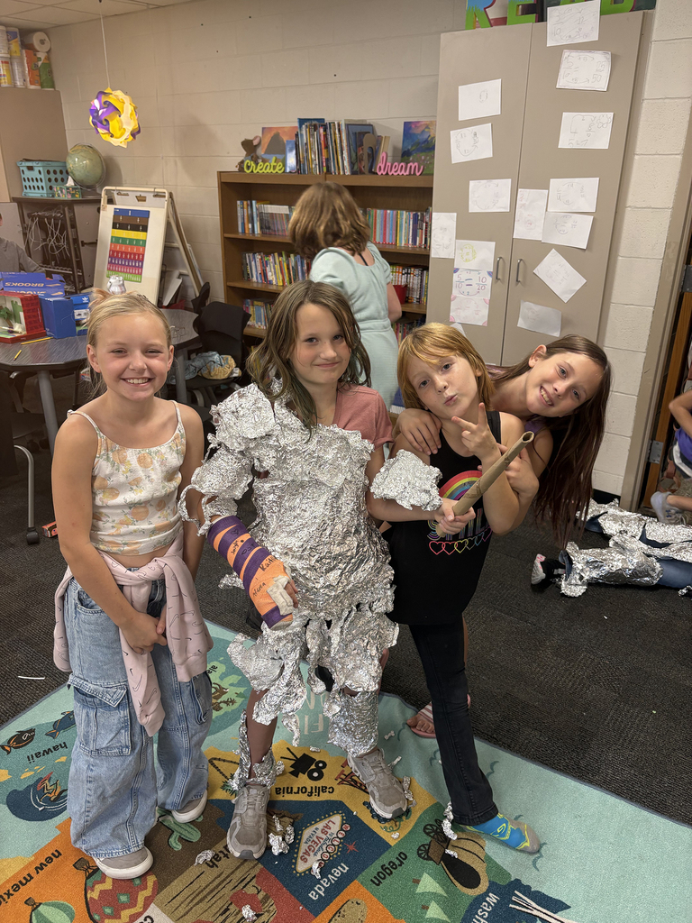 4th graders competing in the "Build a Knight" contest using tin foil to create armor