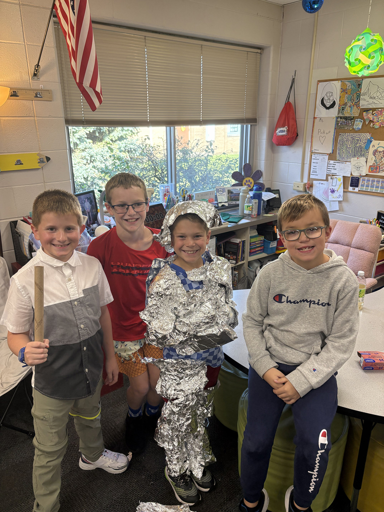 4th graders competing in the "Build a Knight" contest using tin foil to create armor