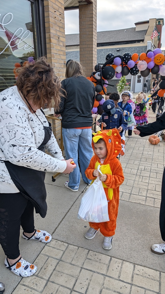 Preschoolers trick or treating downtown