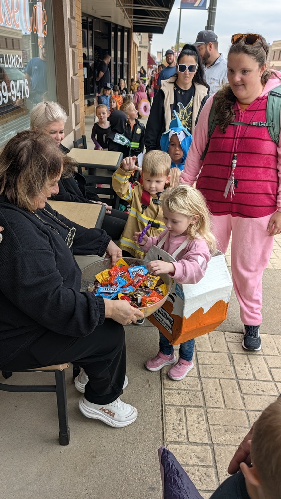 Preschoolers trick or treating downtown