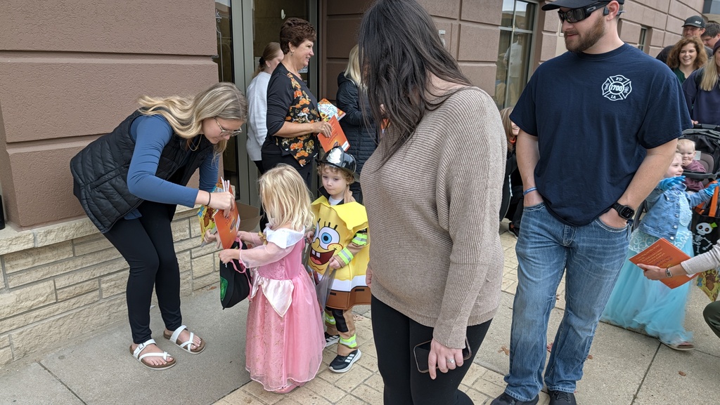 Preschoolers trick or treating downtown