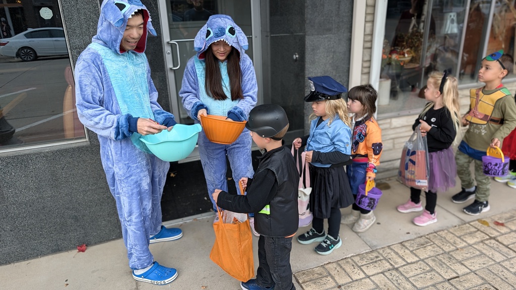 Preschoolers trick or treating downtown