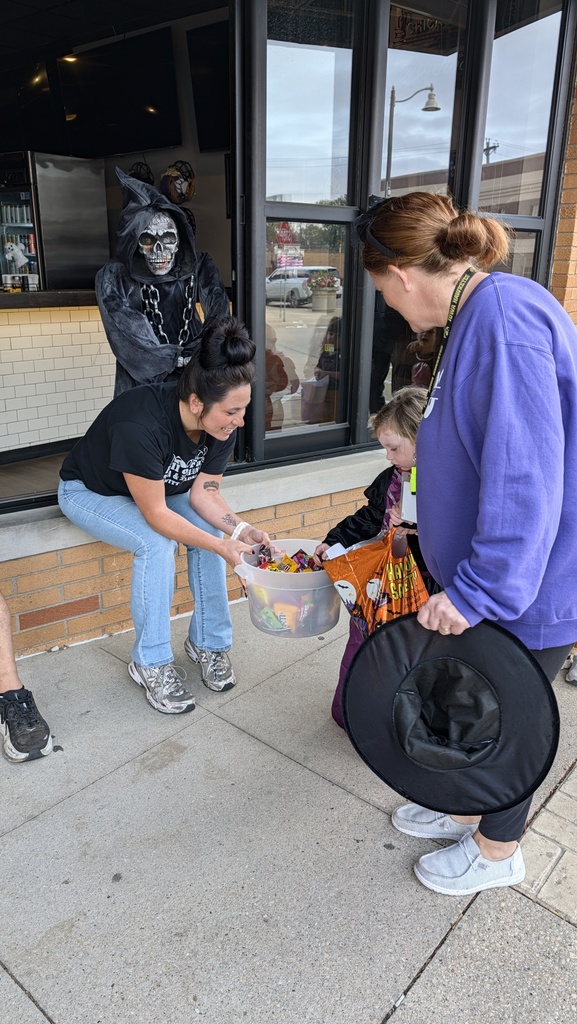 Preschoolers trick or treating downtown