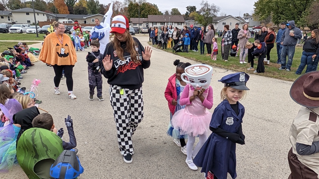 Kindergartners showing off their Halloween costumes in the parade