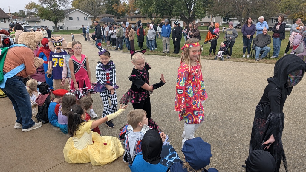 Second graders showing off their Halloween costumes in the parade