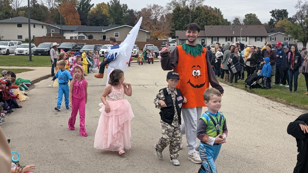Kindergartners showing off their Halloween costumes in the parade
