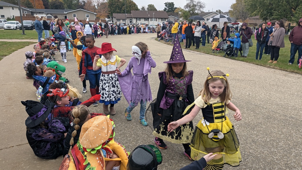 First graders showing off their Halloween costumes in the parade