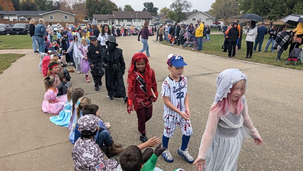 Second graders showing off their Halloween costumes in the parade