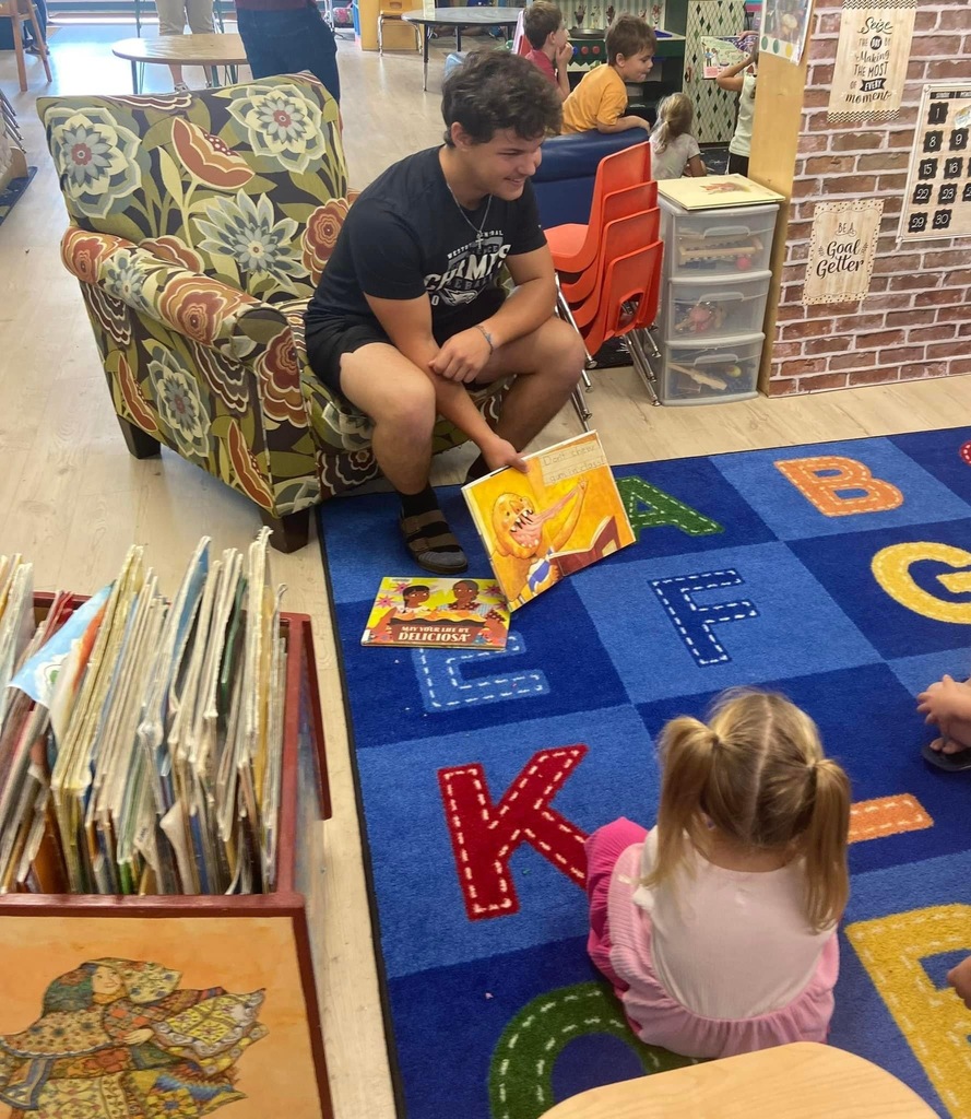 Student reading a picture book