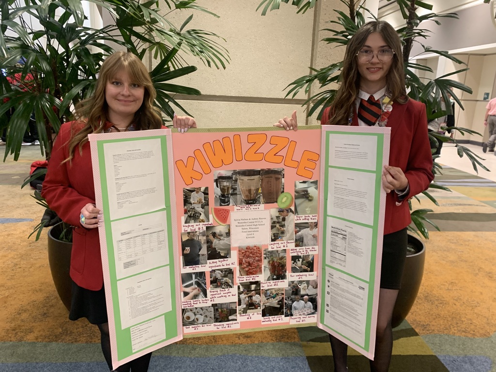 Students with presentation board