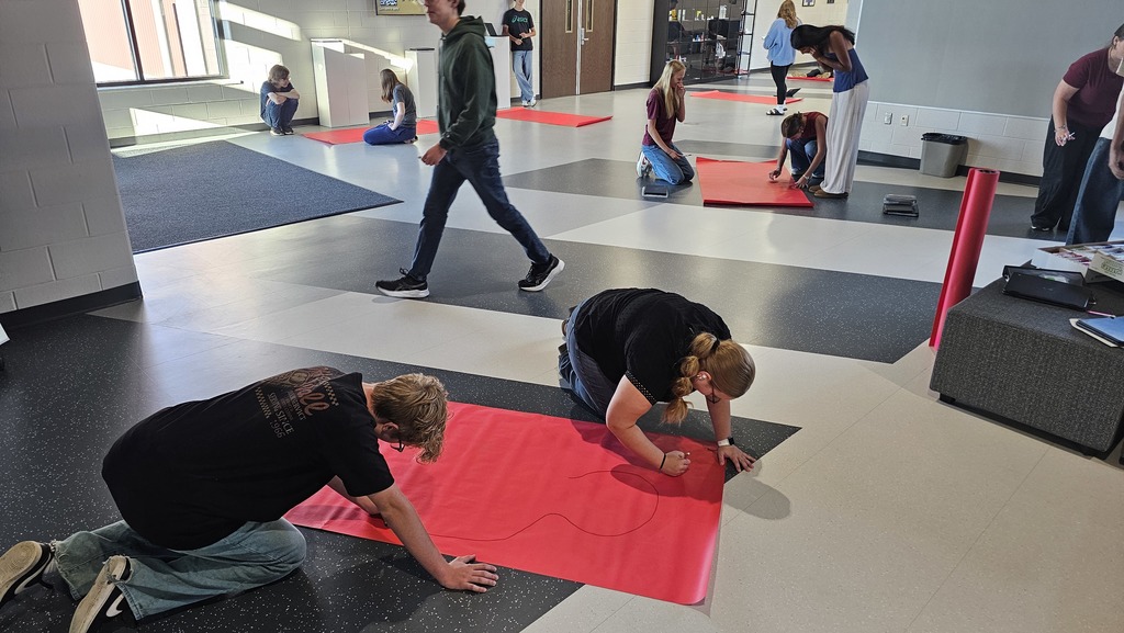 Students working on a poster