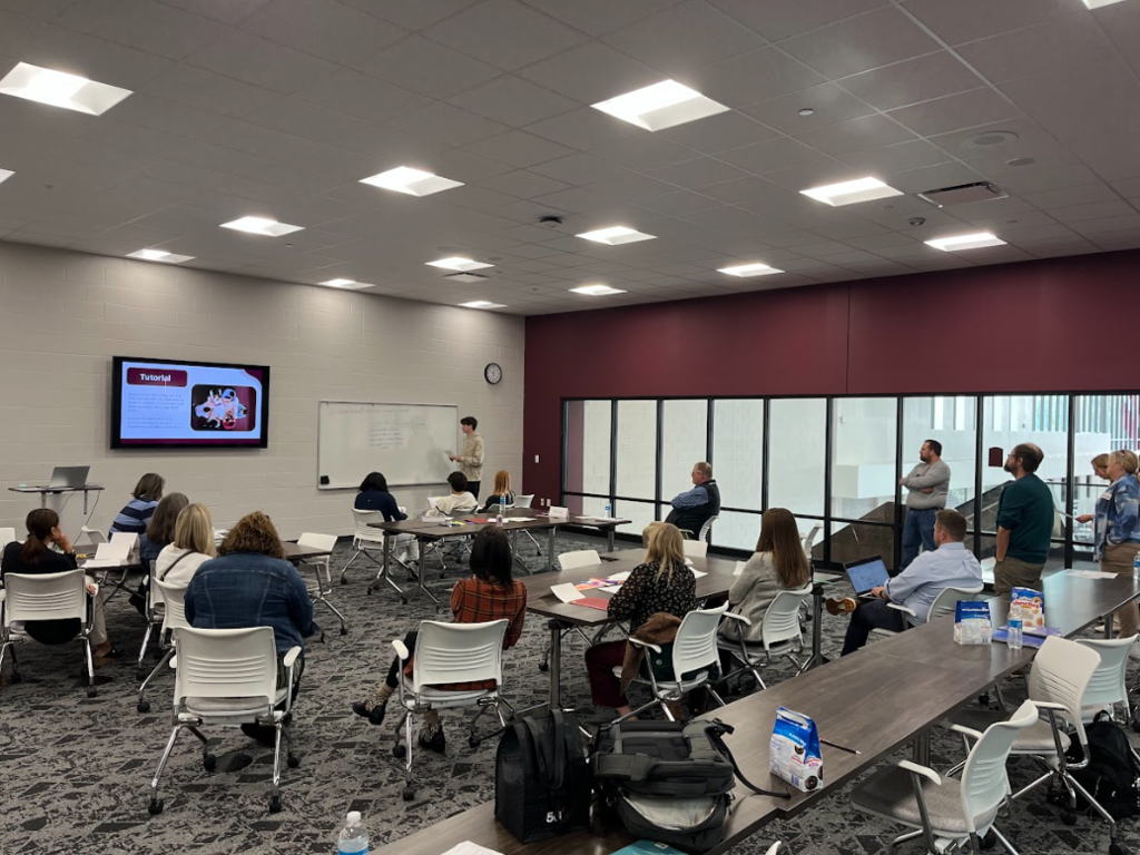 Student presenting to teachers