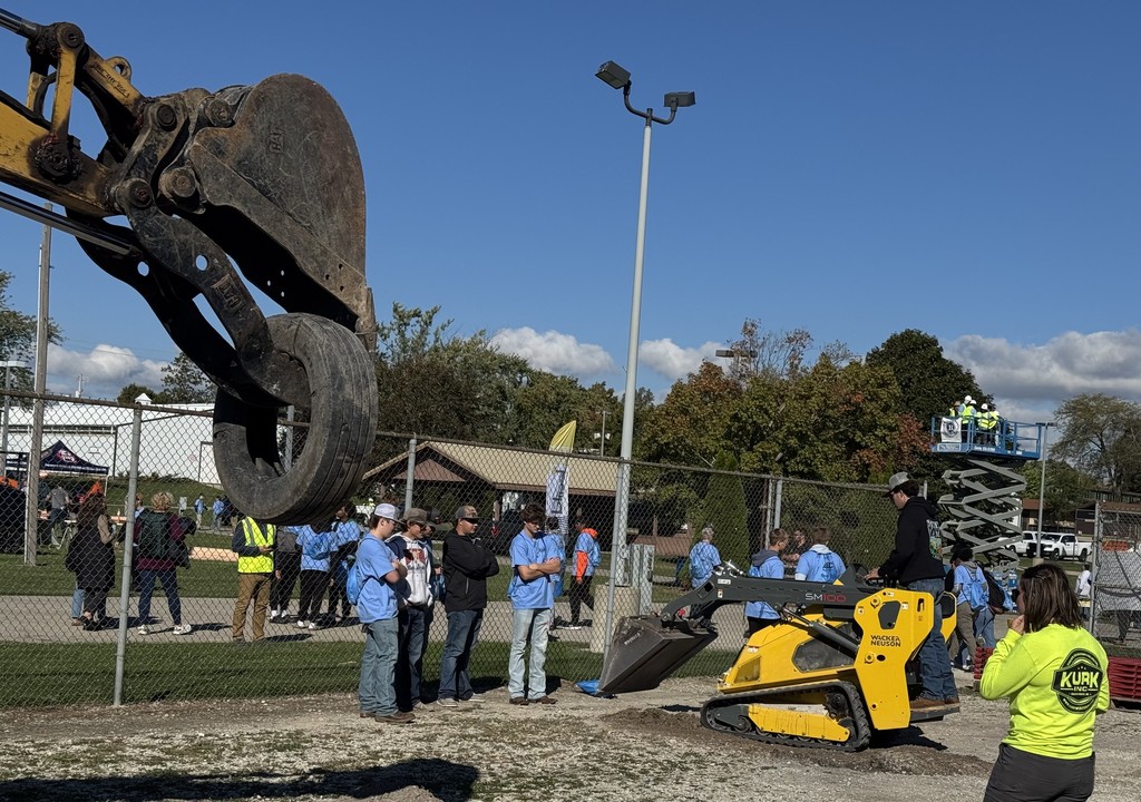 Students operating machinery