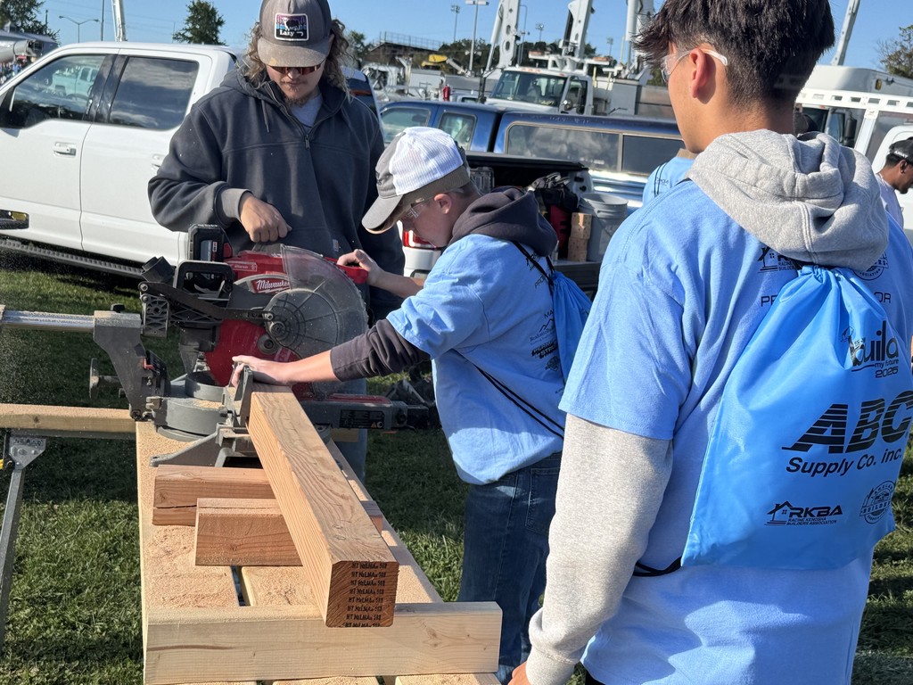 Students working with a saw