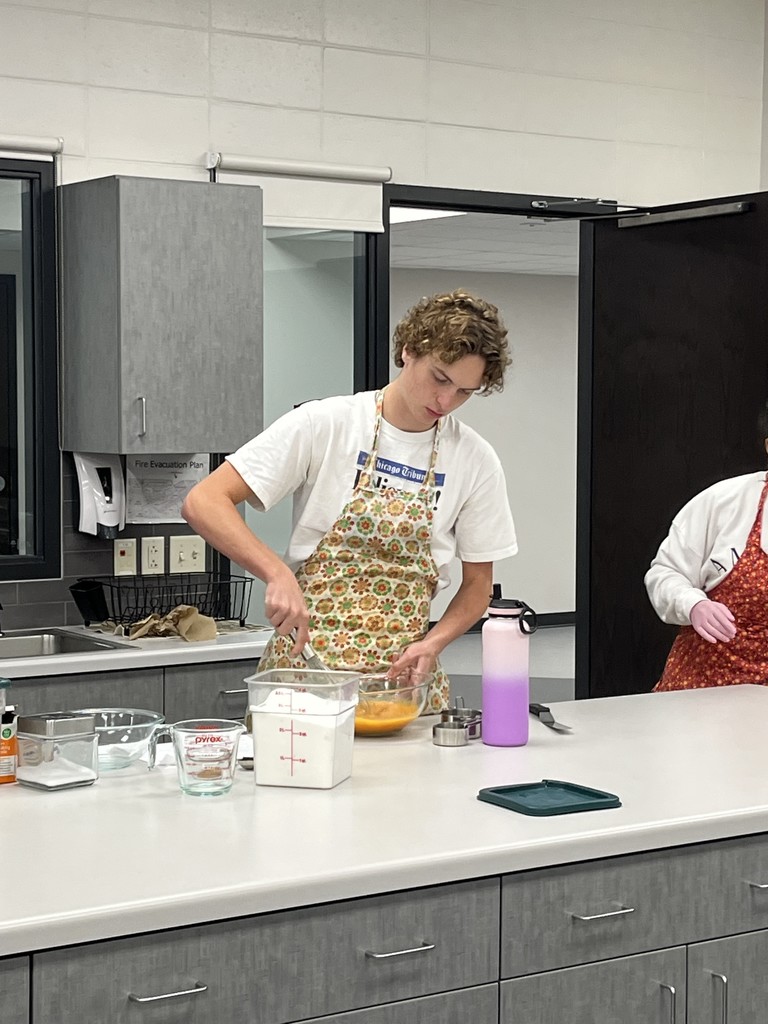 Student mixing ingredients