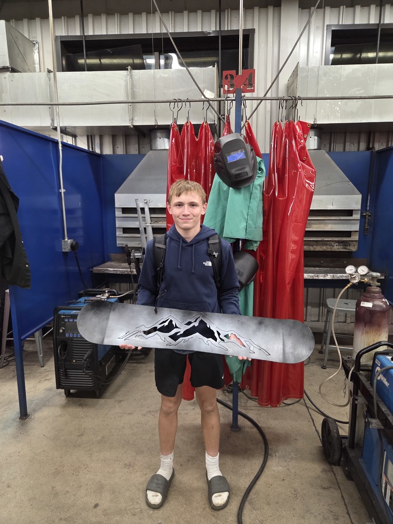 Student holding a project